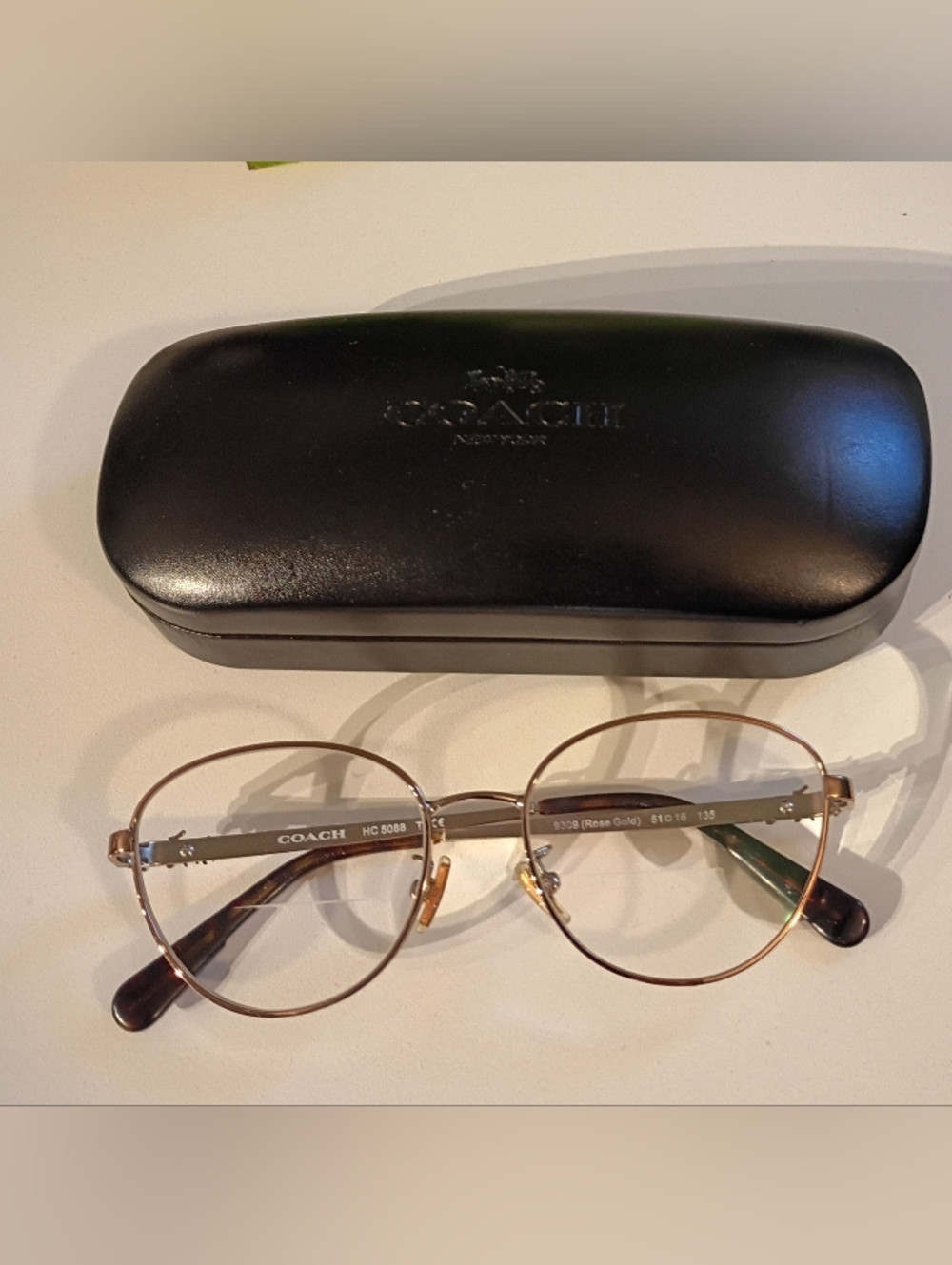 Coach Round Metal Eyeglasses in Rose Gold with Brown Temple Tips